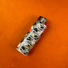 Lighter with floral design on an orange surface