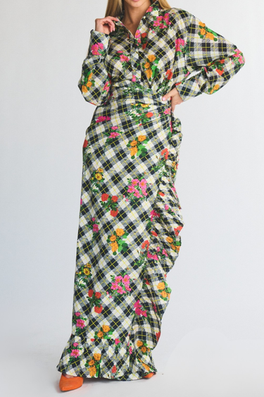 Long floral ruffle power pareo and button down top with plaid pattern on a plain background