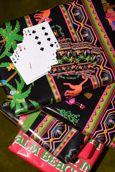 Colorful deck of cards featuring a palm beach design.