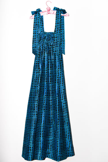 Blue patterned dress on a white background